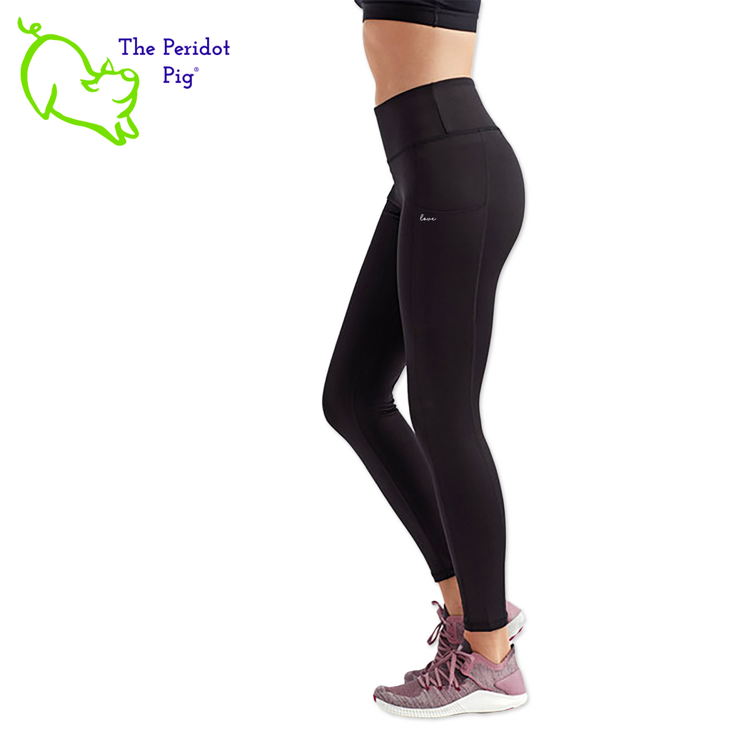 Luxuriate in luxury with the PureBliss Studios Lotus High Rise Capri Legging—super comfortable and breathable with two side pockets, an interior pocket, plus the brand logo on the back right leg in a matte vinyl and a dazzling color lotus on the back. And who wouldn't love a little "love" on the left pocket? Stretchy yet snug-fitting, enjoy the perfect yoga session! Left side view shown.