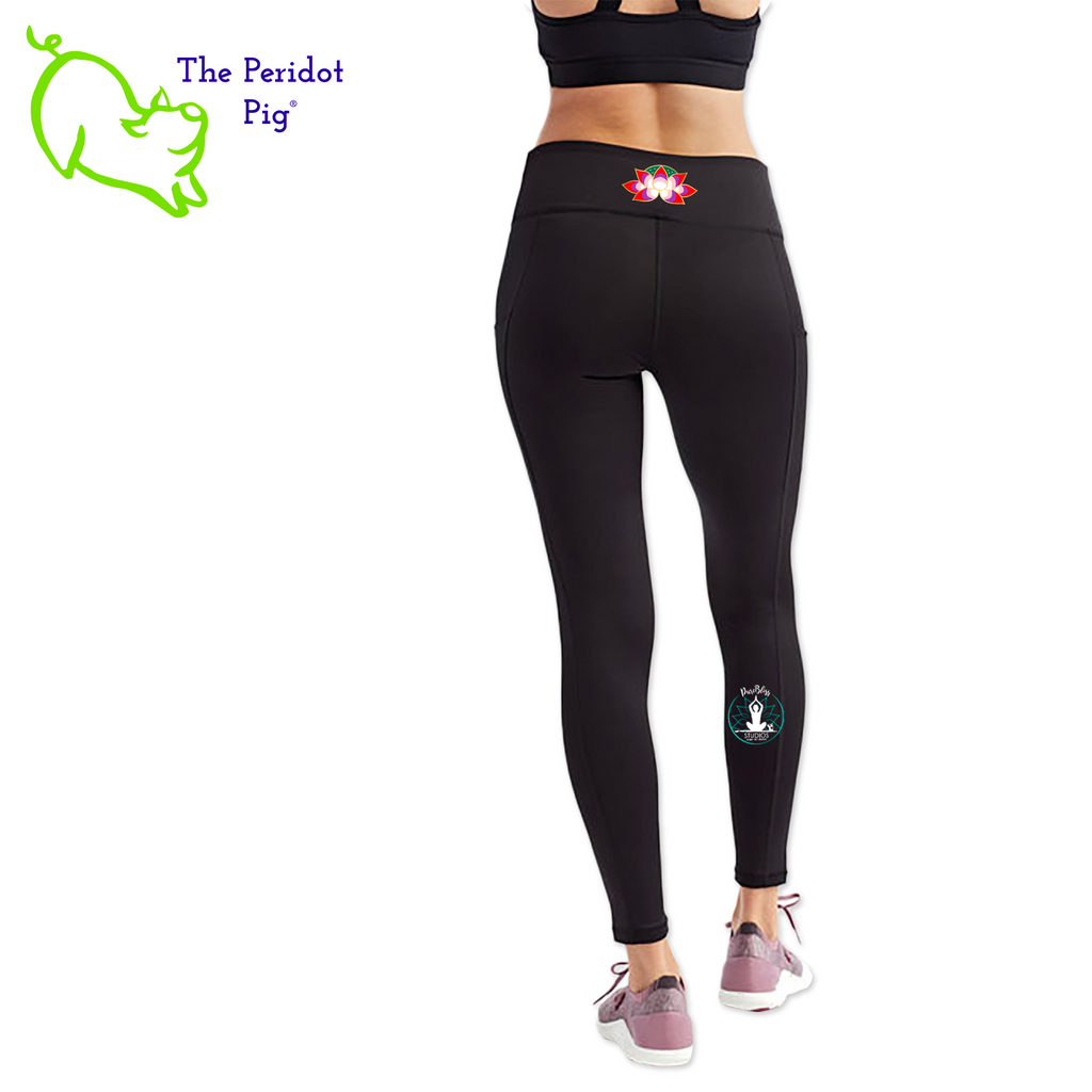 Luxuriate in luxury with the PureBliss Studios Lotus High Rise Capri Legging—super comfortable and breathable with two side pockets, an interior pocket, plus the brand logo on the back right leg in a matte vinyl and a dazzling color lotus on the back. And who wouldn't love a little "love" on the left pocket? Stretchy yet snug-fitting, enjoy the perfect yoga session! Back view shown.
