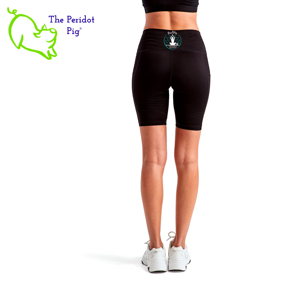 Luxuriate in luxury with the PureBliss Studios Lotus High Rise Legging Short —super comfortable and breathable with two side pockets, an interior pocket, plus the brand logo on the back right leg in a matte vinyl. And who wouldn't love a little "love" on the left pocket? Stretchy yet snug-fitting, enjoy the perfect yoga session! Back view shown.