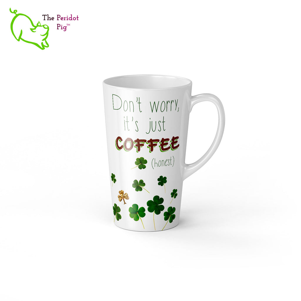 A 17 oz white latte mug. Perfect for an Irish Coffee or a regular cup o'joe. The caption reads, "Don't worry, it's just coffee (honest)" set amid a collection of shamrocks. Right view.