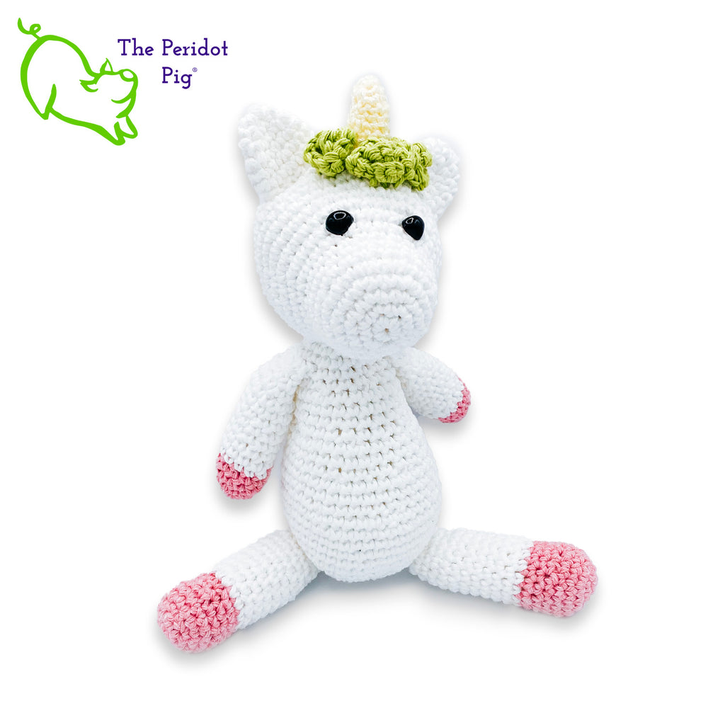 Lily is my first unicorn amigurumi. She's made of sturdy cotton yarn in white, pink, teal and green. She has a cute little yellow horn with three green flowers surrounding her head. She's a soft, squishy toy but still pretty indestructible and meant to last a life-time.  Front view seated shown.