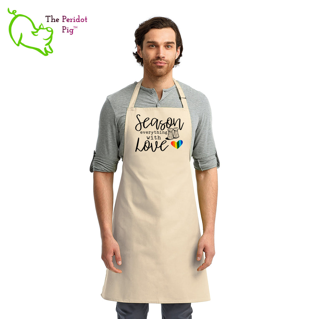 This lovely apron has a printed graphic that states "Season everything with love" on the front with a little rainbow heart. Perfect gift during Pride month or any day for that matter! Front view shown in Natural.
