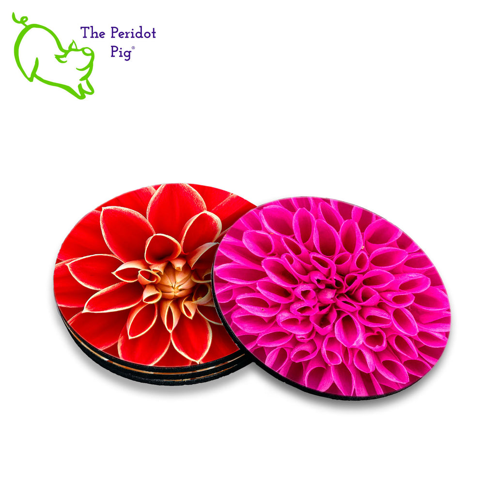 Our neighbor has been fascinated with dahlias this season. We decided to make a set of coasters to tide her over until Spring. This set of four round coasters features closeups of dahlias. Each coaster features a different floral varietal. Shown in a stack of four.