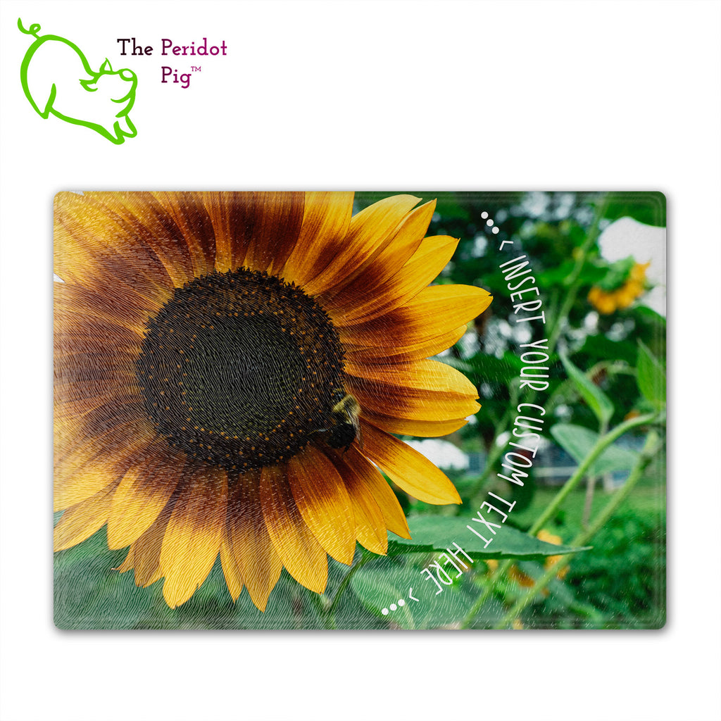 These beautiful tempered glass cutting boards are a wonderful keepsake!  They can be personalized with names, quotes or dates. This one features a huge sunflower with a little honey bee in a vivid and detailed print. The text can wrap around as shown or be formatted in a block if longer. Front view.