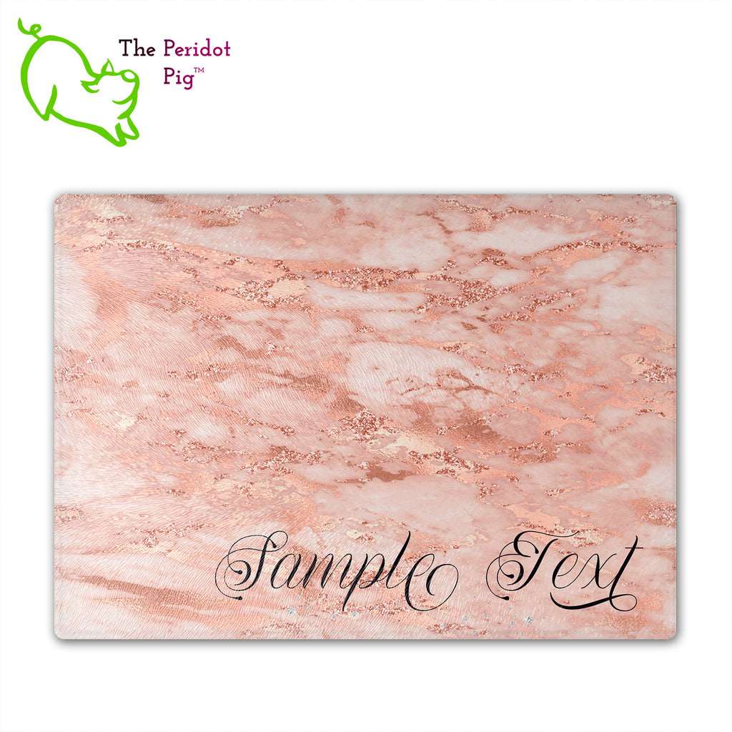 These beautiful tempered glass cutting boards are a wonderful keepsake!  They can be personalized with names, quotes or dates. These feature swirling marbles in rose gold and glitter foil in a vivid and detailed print. We prefer a scrolling script for the personalization in this design. There is also a little bling under the name included too. Front view with sample text. Style A