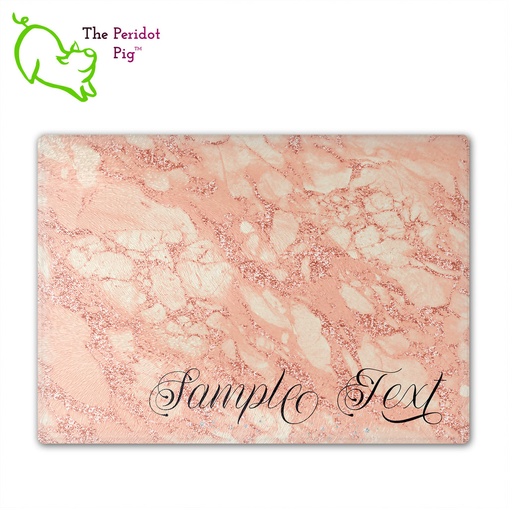 These beautiful tempered glass cutting boards are a wonderful keepsake!  They can be personalized with names, quotes or dates. These feature swirling marbles in rose gold and glitter foil in a vivid and detailed print. We prefer a scrolling script for the personalization in this design. There is also a little bling under the name included too. Front view with sample text. Style D