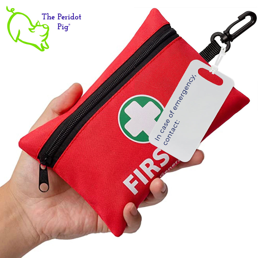 All the essential first aid items are gathered in this compact first aid kit. We've included an external tag so you can add your own In Case of Emergency (ICE) contact information. Back of tag shown.