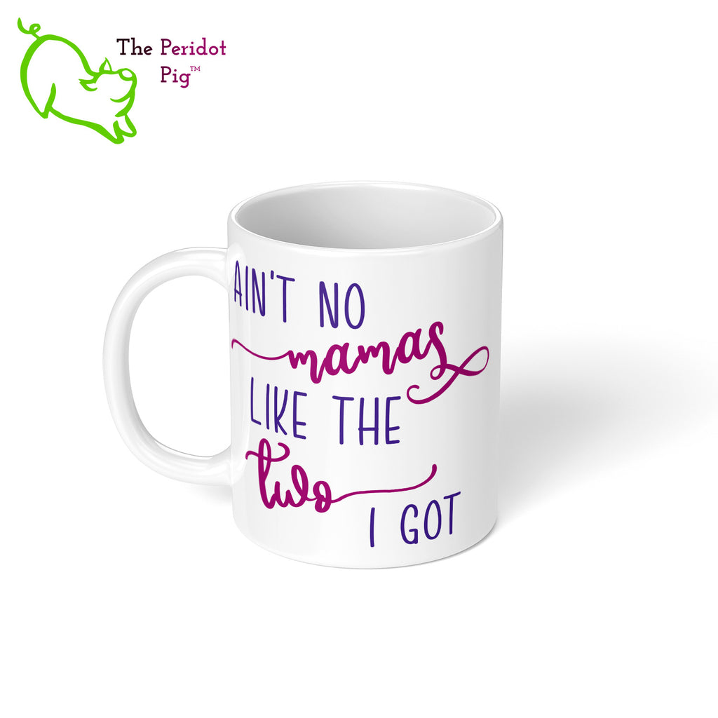 A shout out to our LGTQB Moms! Celebrate Mother's day with a gift that embraces your pride. The mug says, "Ain't no mamas like the two I got" on the front. On the back, it has rainbow stripes with the saying, "Love is love". Left view