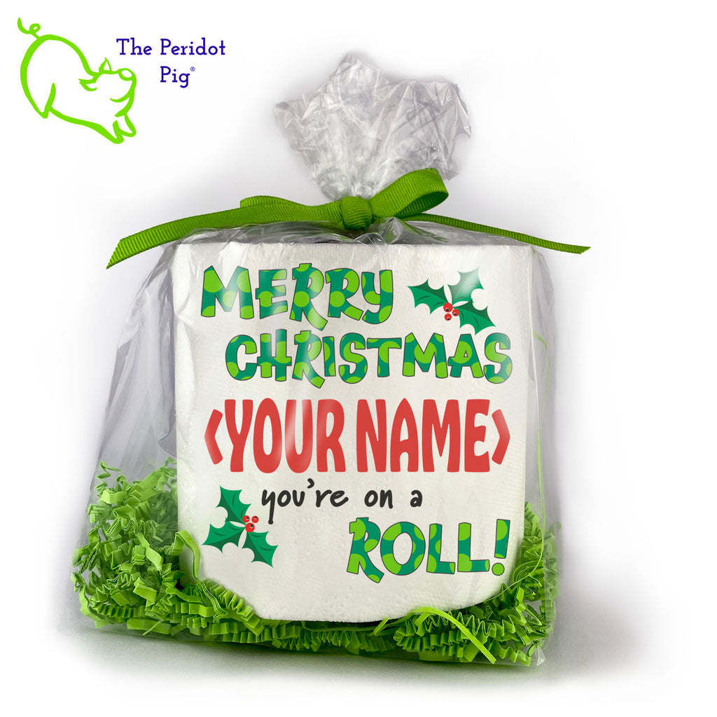 Available with many different sayings, this is high-quality 2-ply toilet paper which has been printed in vivid sublimation color. We then wrap it all up with some peridot green crinkle paper and a matching bow. This version can be personalized with any name! It says "Merry Christmas <Your Name> you're on a ROLL!" Front view shown.