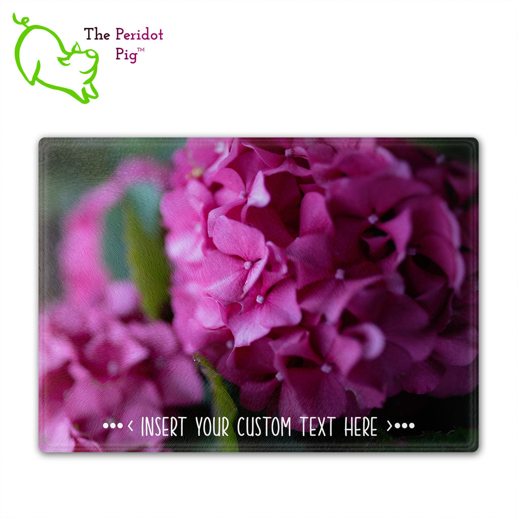 These beautiful tempered glass cutting boards are a wonderful keepsake!  They can be personalized with names, quotes or dates. This one features bright purple pink hydrangeas in a vivid and detailed print. Perfect for cutting or using as a serving board! Fron view with no highlights.