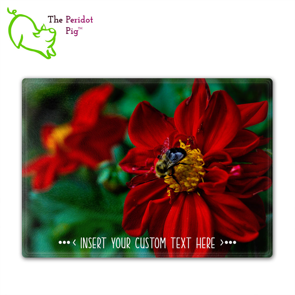 These beautiful tempered glass cutting boards are a wonderful keepsake!  They can be personalized with names, quotes or dates. This one features a bright red flower with a cute little honey bee in a vivid and detailed print. Perfect for cutting or using as a serving board! Front view without highlights.