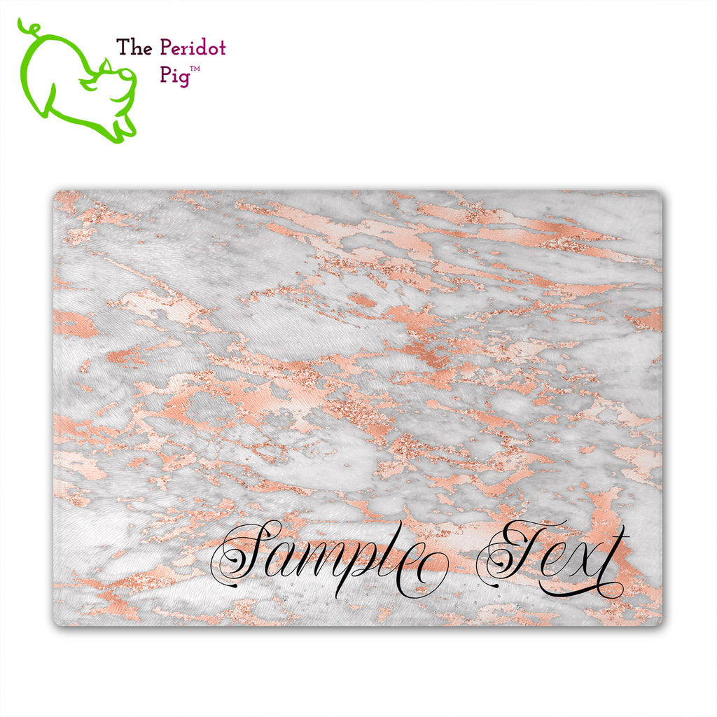 These beautiful tempered glass cutting boards are a wonderful keepsake!  They can be personalized with names, quotes or dates. These feature swirling marbles in rose gold and glitter foil in a vivid and detailed print. We prefer a scrolling script for the personalization in this design. There is also a little bling under the name included too. Front view with sample text with no highlights. Style B