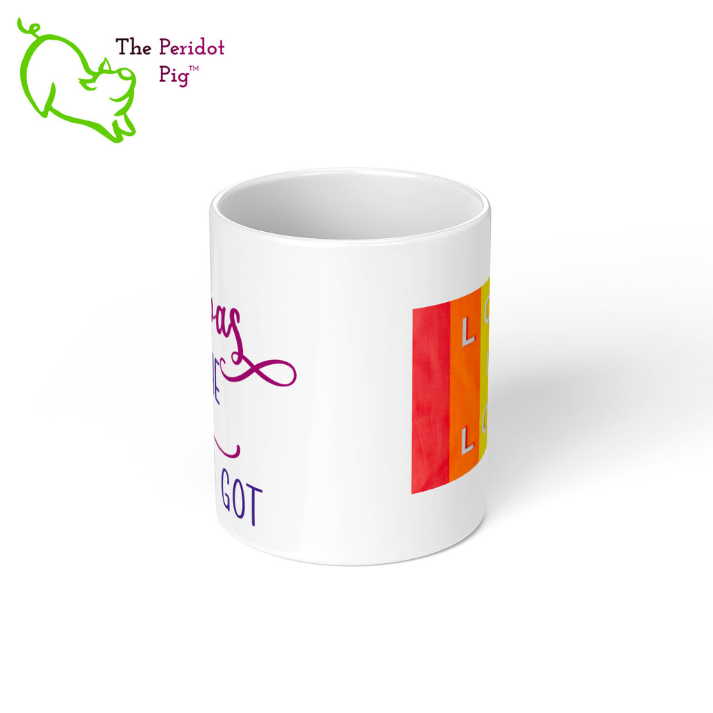 A shout out to our LGTQBA Dads! Celebrate Father's day with a gift that embraces your pride. The mug says, "Ain't no papas like the two I got" on the front. On the back, it has rainbow stripes with the saying, "Love is love". Center view.
