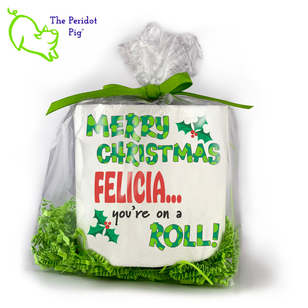 Available with many different sayings, this is high-quality 2-ply toilet paper which has been printed in vivid sublimation color. We then wrap it all up with some peridot green crinkle paper and a matching bow. This version can be personalized with any name! It says "Merry Christmas <Your Name> you're on a ROLL!". Front view show with a sample name.