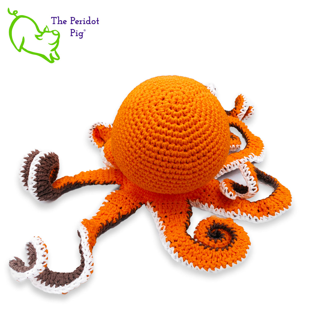 My husband thought an octopus only comes in black but we begged to differ! The North Pacific Giant Octopus come is a lovely shade of orange like our Olivia. At first glance, she's a bit intimidating but in reality, she is soft and cuddly. Olivia is made from sturdy cotton and is meant to last a life-time. Back view shown.