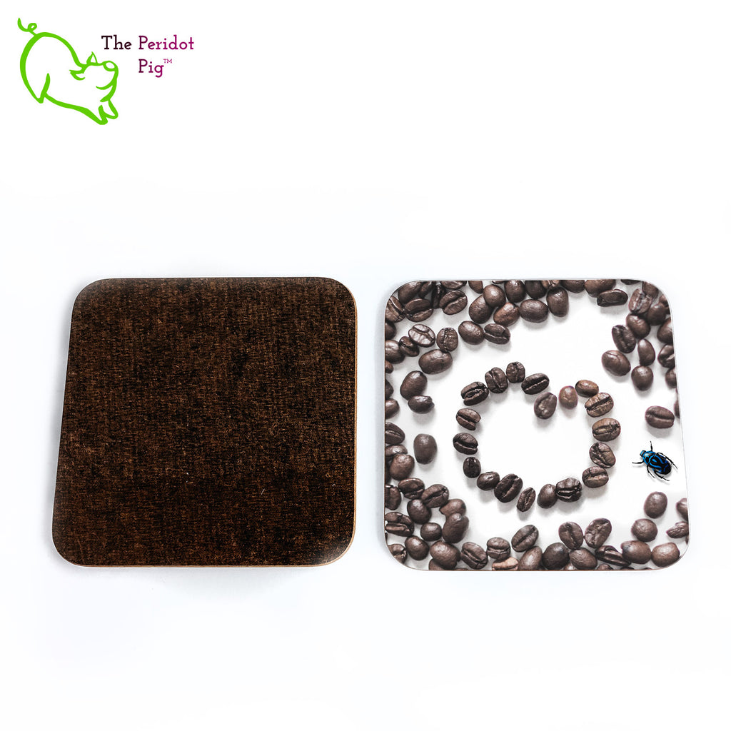 This set of four square coasters is printed with a vivid, detailed image of coffee beans. There's a heart in the middle and a little blue beetle off to the right side. The coasters are printed in a durable ink that won't fade over time. Perfect for both hot and cold beverages. Showing front and back.
