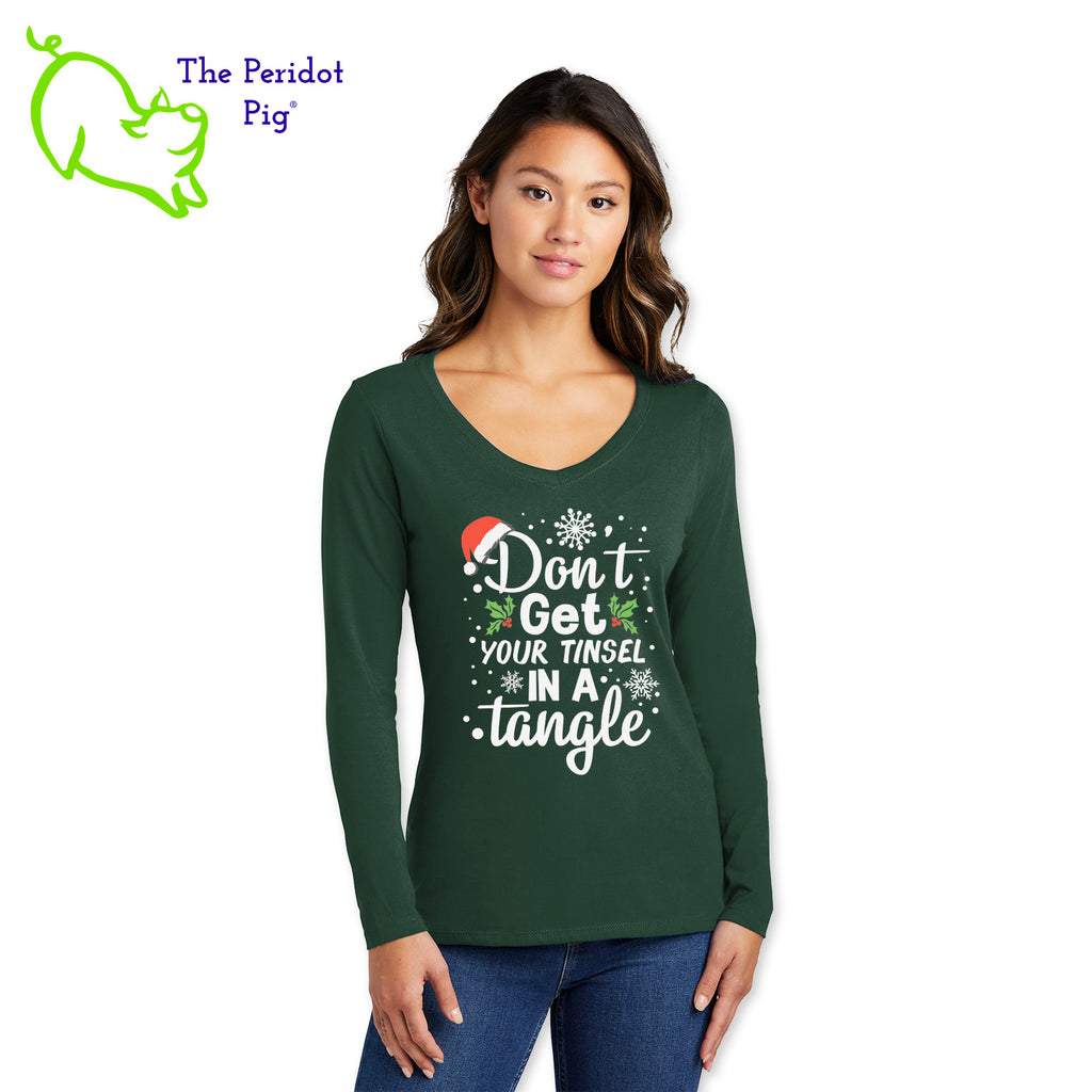 The holidays can be stressful for some. Tell them to chill out with our favorite 100% ring spun cotton tee. It's very soft and tailored for a woman's fit. The front says, "Don't get your tinsel in a tangle" in bright festive colors. There are holly berries, a jaunty Santa hat and snow flakes to round out the design. The back is undecorated. Front view shown in Forest Green.