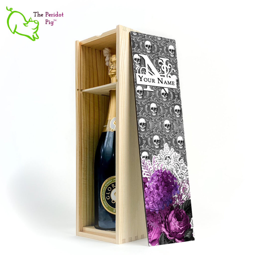 A gift wine box with decorated panel. The front panel is decorated in a glossy, detailed print with a monogram and space for a customized name. This model has a background of Victorian skulls with a bouquet of purple flowers and lace. Inside view with a sample bottle shown in natural finish.
