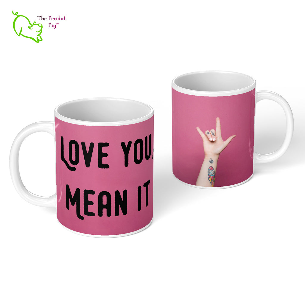 Our 11 oz coffee mug has the printed phrase, "Love You, Mean It" one one side and the raised hand on the other spelling "I love you" in ASL. Front and back view.