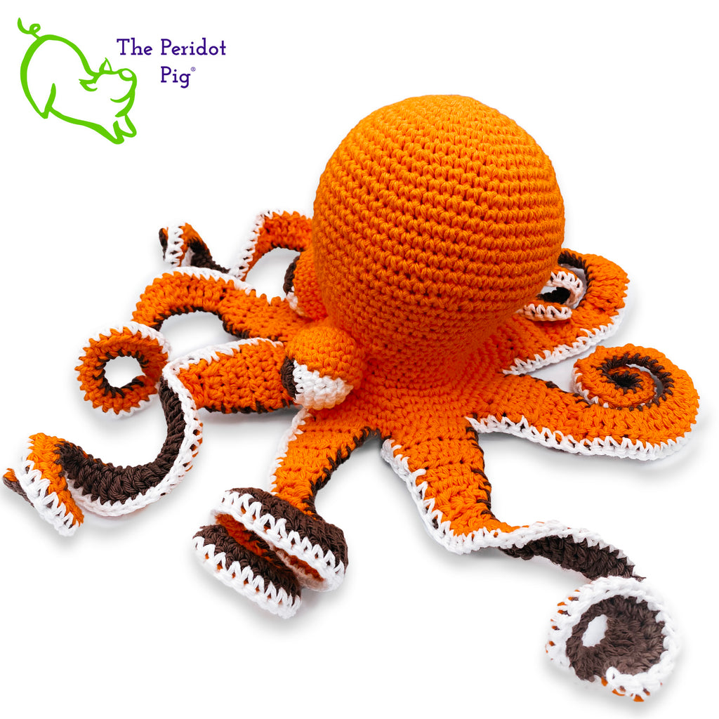 My husband thought an octopus only comes in black but we begged to differ! The North Pacific Giant Octopus come is a lovely shade of orange like our Olivia. At first glance, she's a bit intimidating but in reality, she is soft and cuddly. Olivia is made from sturdy cotton and is meant to last a life-time. Left view shown.