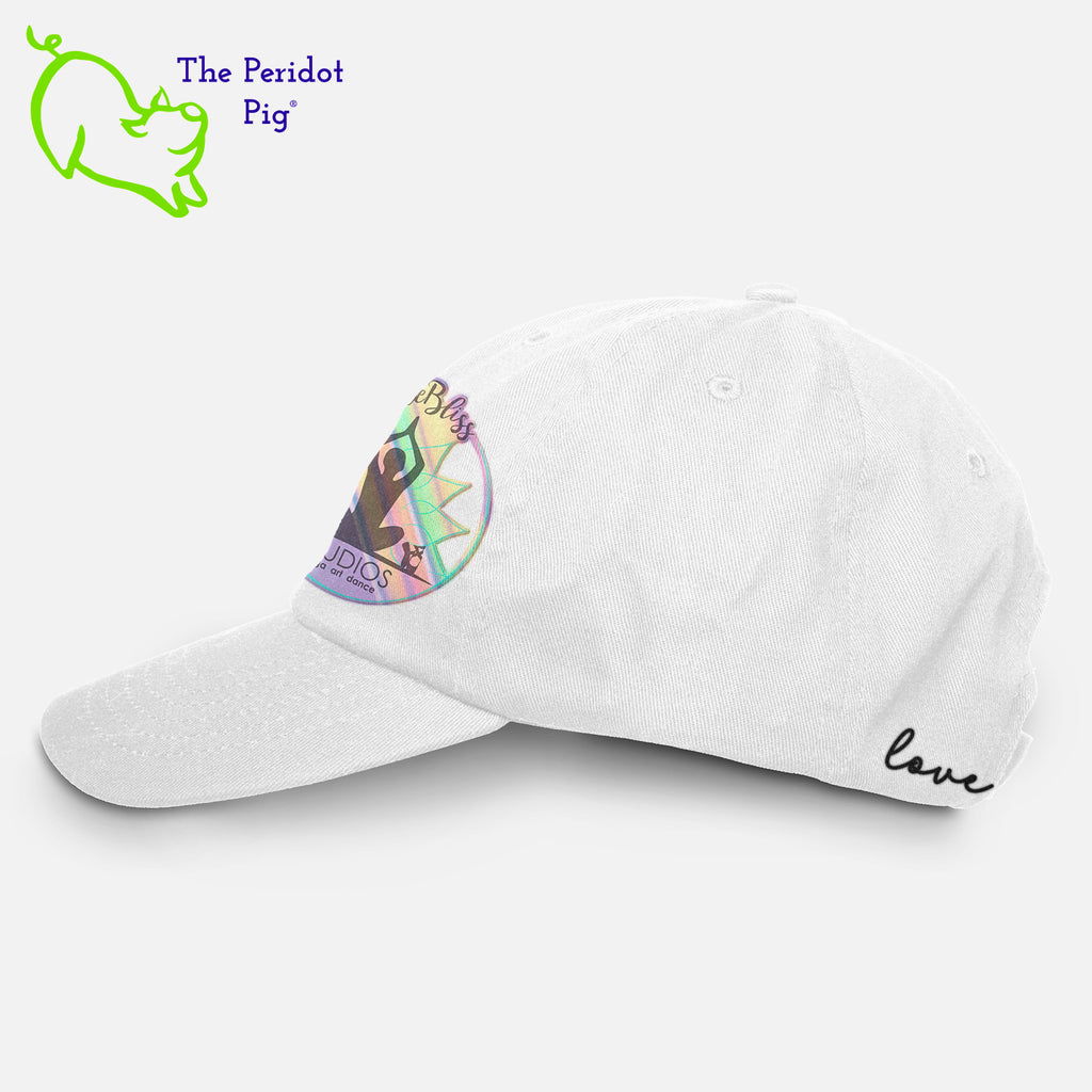 This 6-Panel twill unstructured cap is perfect for a bit of shade or to pull back a pony tail. The PureBliss Studios logo is printed on the front in a fun hologram print. A little "love" is on the back left side as well. Left view shown in white.