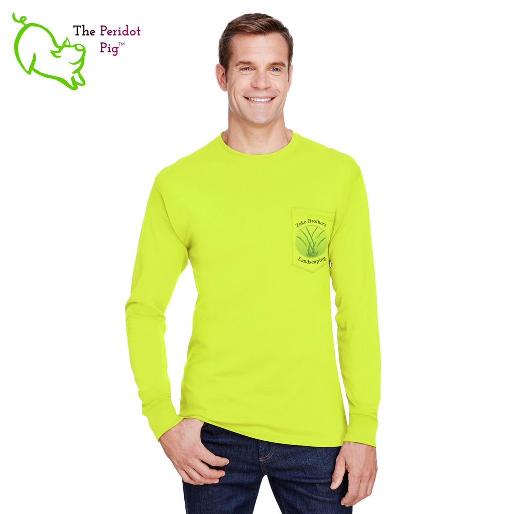 A saftey green long sleeve t-shirt featuring the Zako Brothers logo on the left front pocket. A larger version of the logo is printed on the back. Front view.