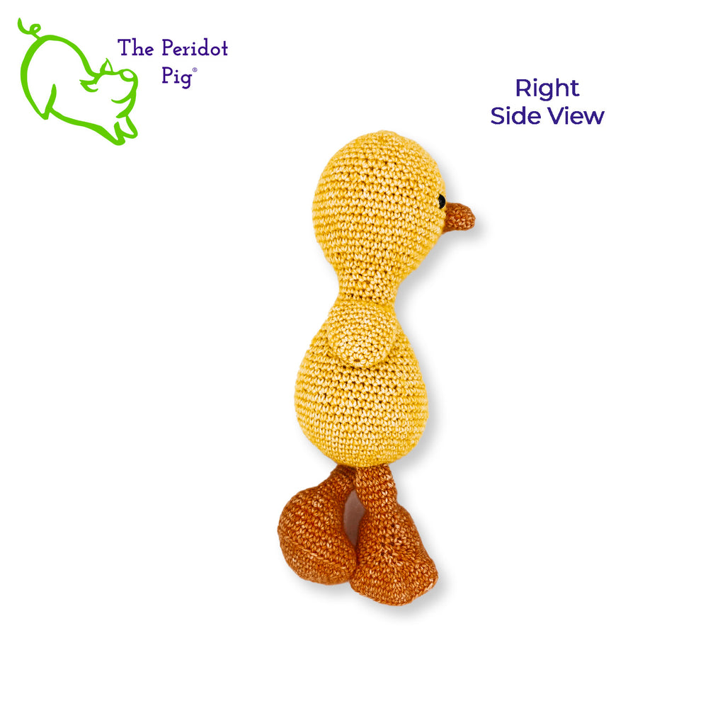 Susie is a rather serious little duckling. The gleam in her eyes, the slight tilt to her head. She's intensely focused. But it's the big duck feet that make her so cute! She's hand crocheted out of a soft cotton/acrylic blend and will last a lifetime. She's stuffed enough that her head stays upright but her legs are floppy enough to have her seated. Right side view shown.