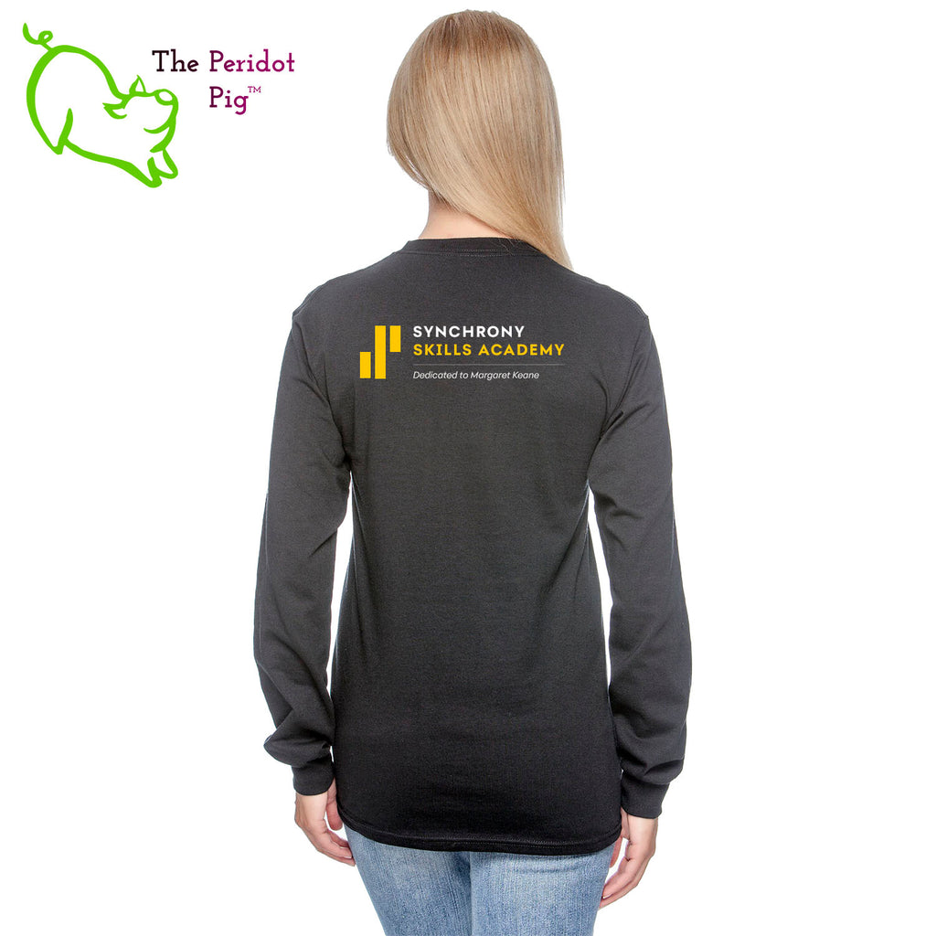 The Synchrony Financial Skills Academy Logo long sleeve shirt is made of 100% super soft cotton. The front features a small version of the logo on the left pocket area. The back has a larger version of the logo. Back view in black on model.