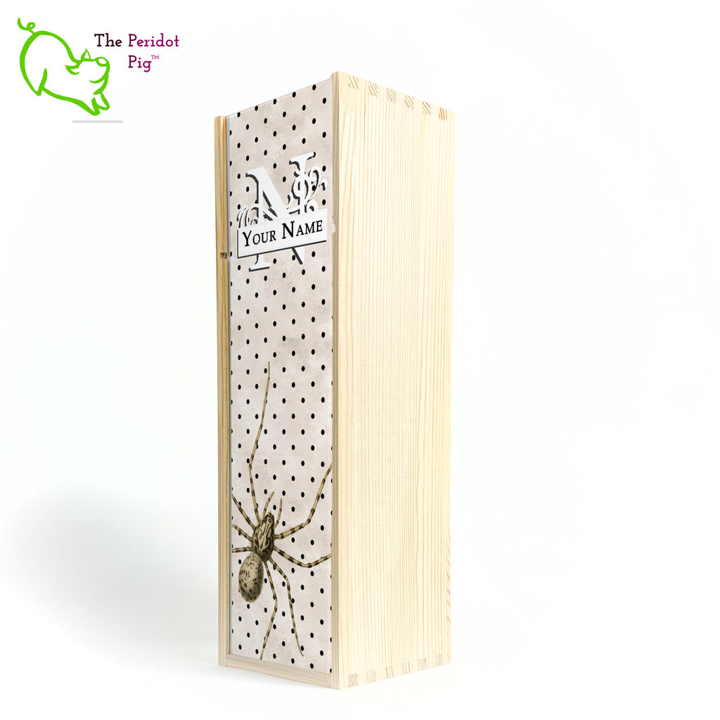 The wine box front panel is decorated in a glossy, detailed print with a white monogram and space for a customized name. This model has a mottled beige background with a pattern of black dots. In the foreground is a large drawing of huge spider. Not for the faint at heart! Natural version showing the front view.