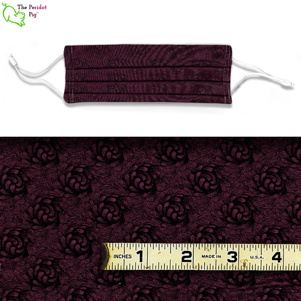 Another subtle floral pattern comprised of a dark burgundy background with a black swirling floral print. Shown front view and pattern size.