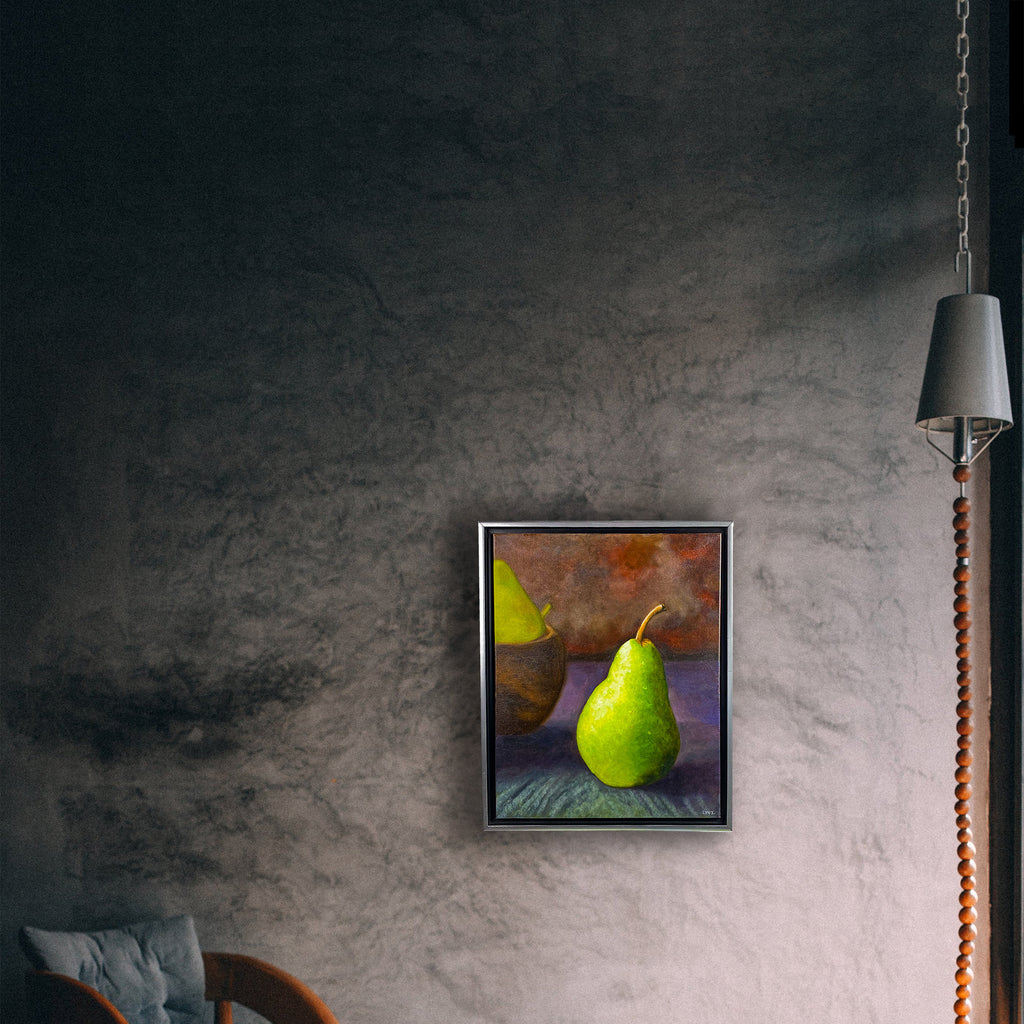 A wall mockup of a painting of a pear with dew drops and a bowl of pears in the background. Signed "LYNZ" by artist C. Lynn Arnold. Oil on canvas.
