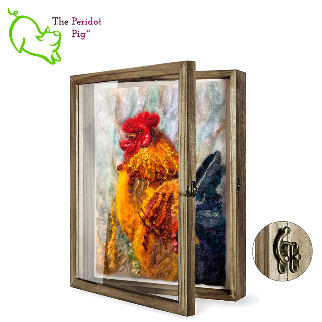 This needle felt 2D "painting" depicts a rooster in full color glory. It's crafted from 100% wool, even the feathers! Each one is unique and may vary a little in color and texture.  The art is needle felted onto a wool backing and measures 12 x 14 x .75".  Shown in a 13" x 16" shadow box, hinged frame.