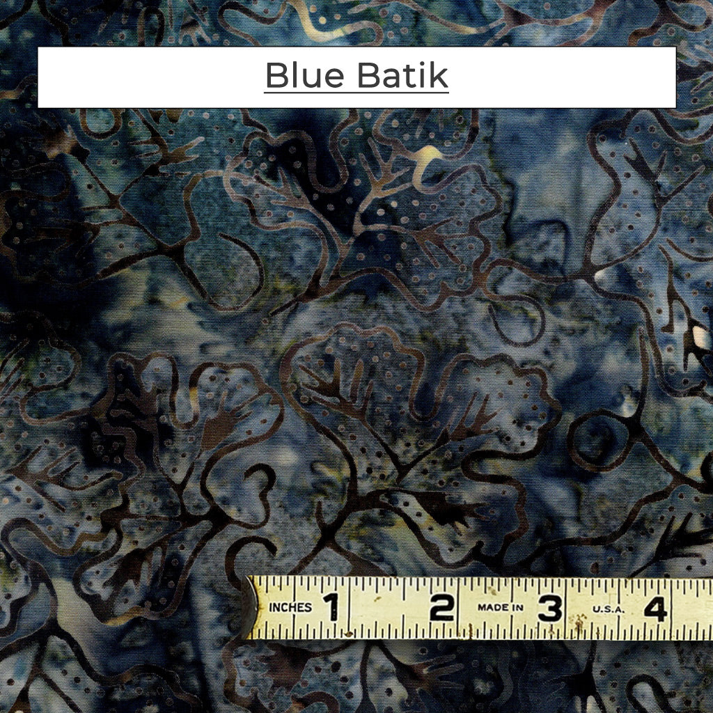 The Blue Batik fabric is a dark grey, blue with scrolling vines.  There's a sheen of golden brown running through the pattern. The cloth has a luscious feel to it!
