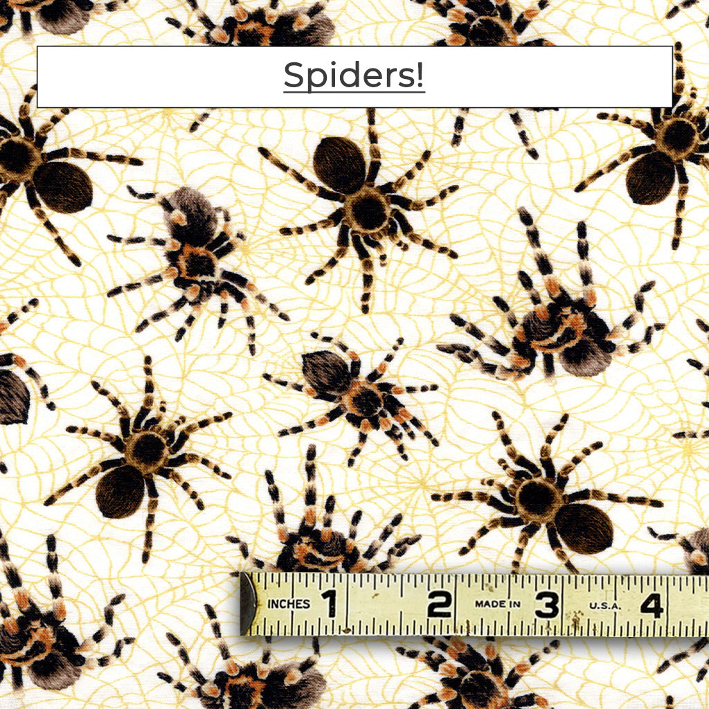 The Spiders fabric has tarantula spiders on an ivory background with golden spider webs.