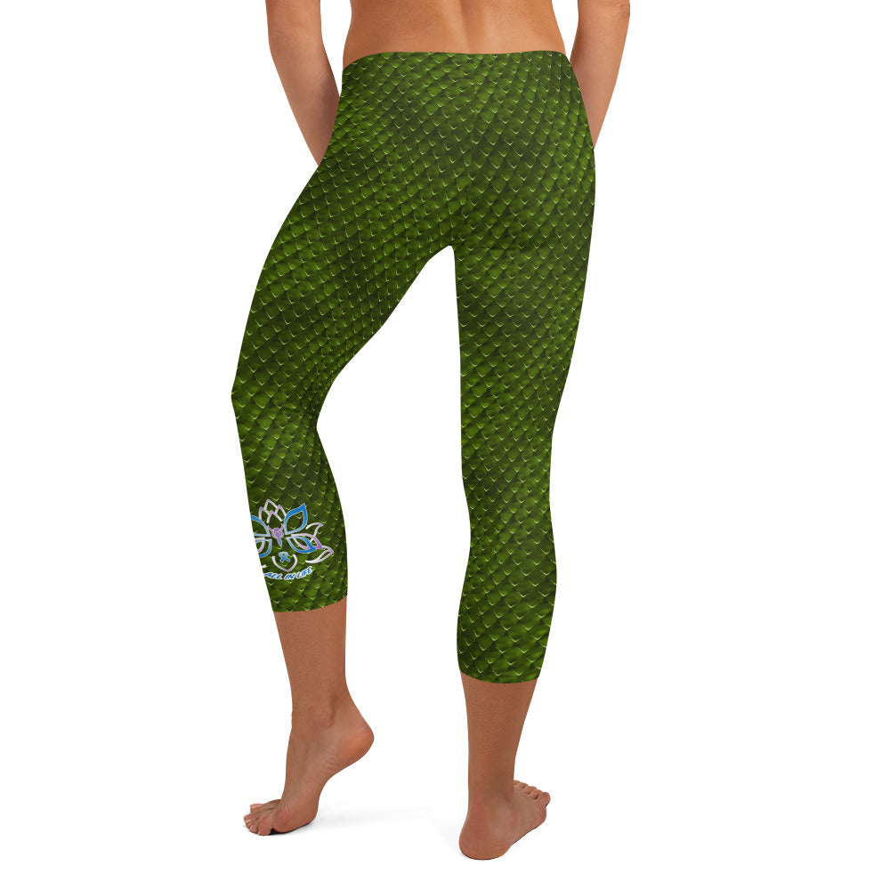 Kristin Zako embodies the "Wild & Free" spirit of her print capri leggings. These are printed in vivid color with a stylized cheetah print. The words, "WILD & FREE" are down the right leg and you'll find Kristin's logo on the lower left leg. Snake skin style - back view.