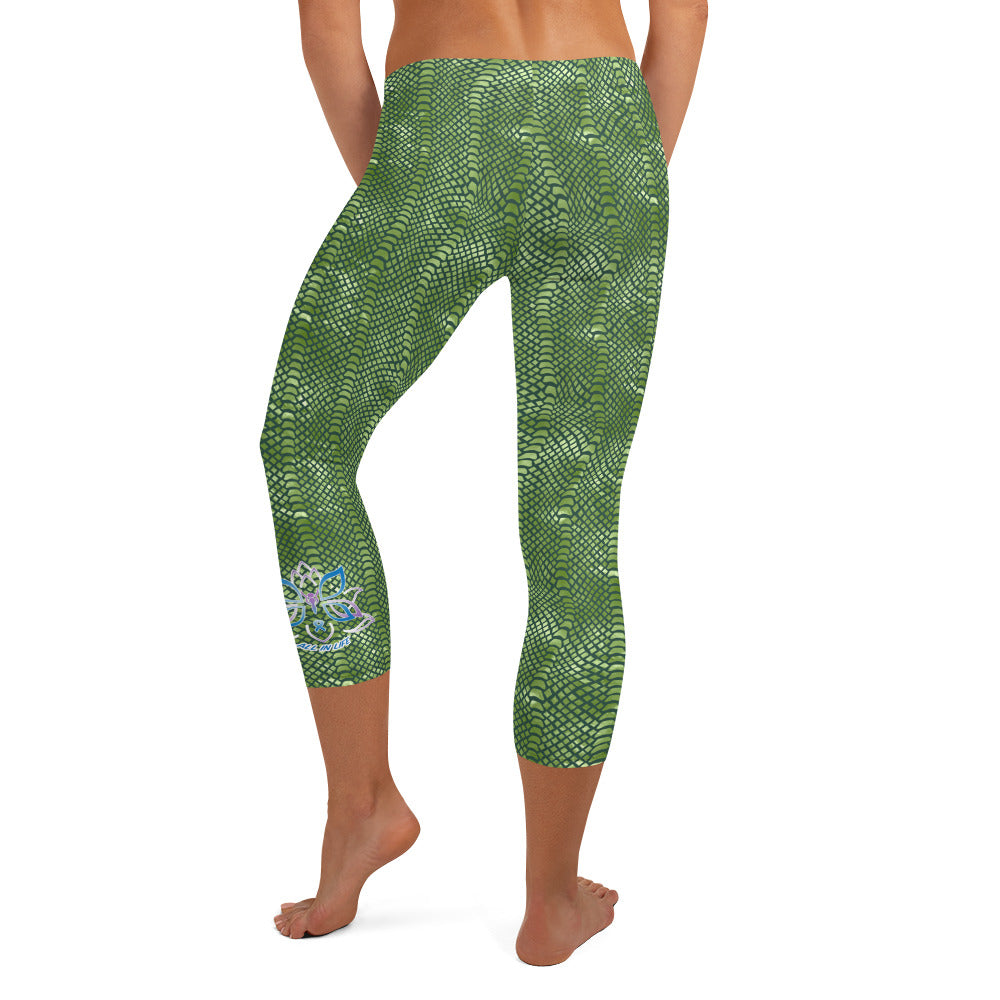 Kristin Zako embodies the "Wild & Free" spirit of her print capri leggings. These are printed in vivid color with a stylized cheetah print. The words, "WILD & FREE" are down the right leg and you'll find Kristin's logo on the lower left leg. Crocodile style - back view.