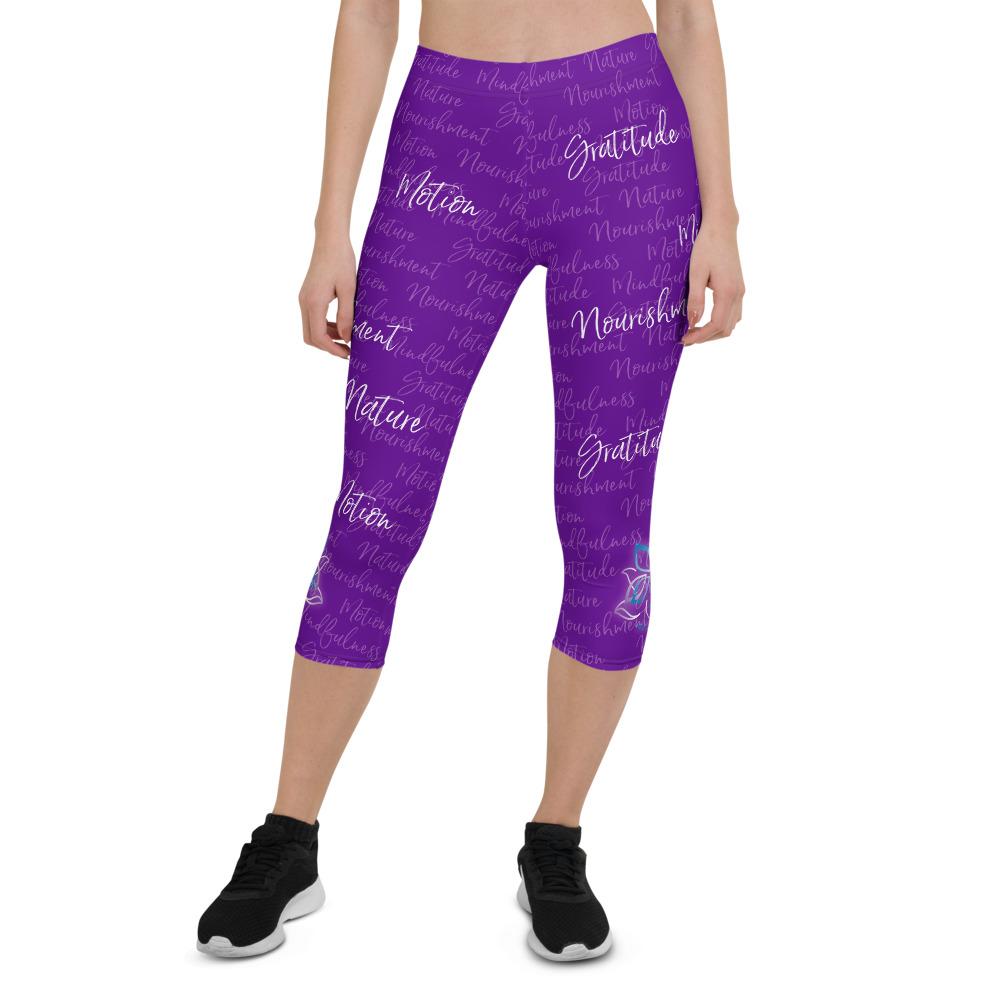 These Kristin Zako capri leggings are filled with her four pillars phrases and topped off with her logo on each side. They are super soft and comfortable. Shown in purple, front view.