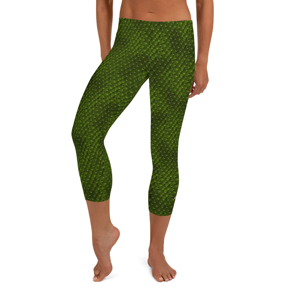 Kristin Zako embodies the "Wild & Free" spirit of her print capri leggings. These are printed in vivid color with a stylized cheetah print. The words, "WILD & FREE" are down the right leg and you'll find Kristin's logo on the lower left leg. Snake skin style - Front view.