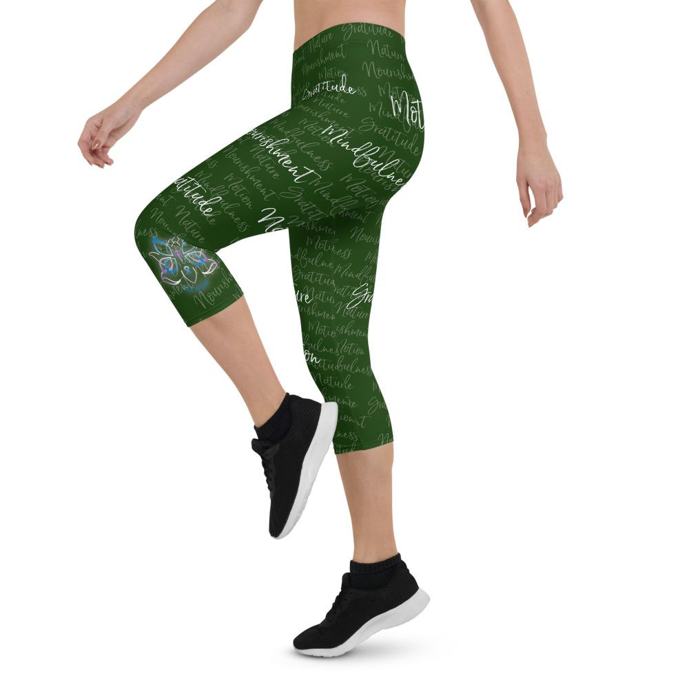 These Kristin Zako capri leggings are filled with her four pillars phrases and topped off with her logo on each side. They are super soft and comfortable. Shown in green, left view.