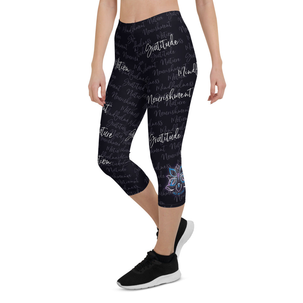 These Kristin Zako capri leggings are filled with her four pillars phrases and topped off with her logo on each side. They are super soft and comfortable. Shown in black, front  left view.