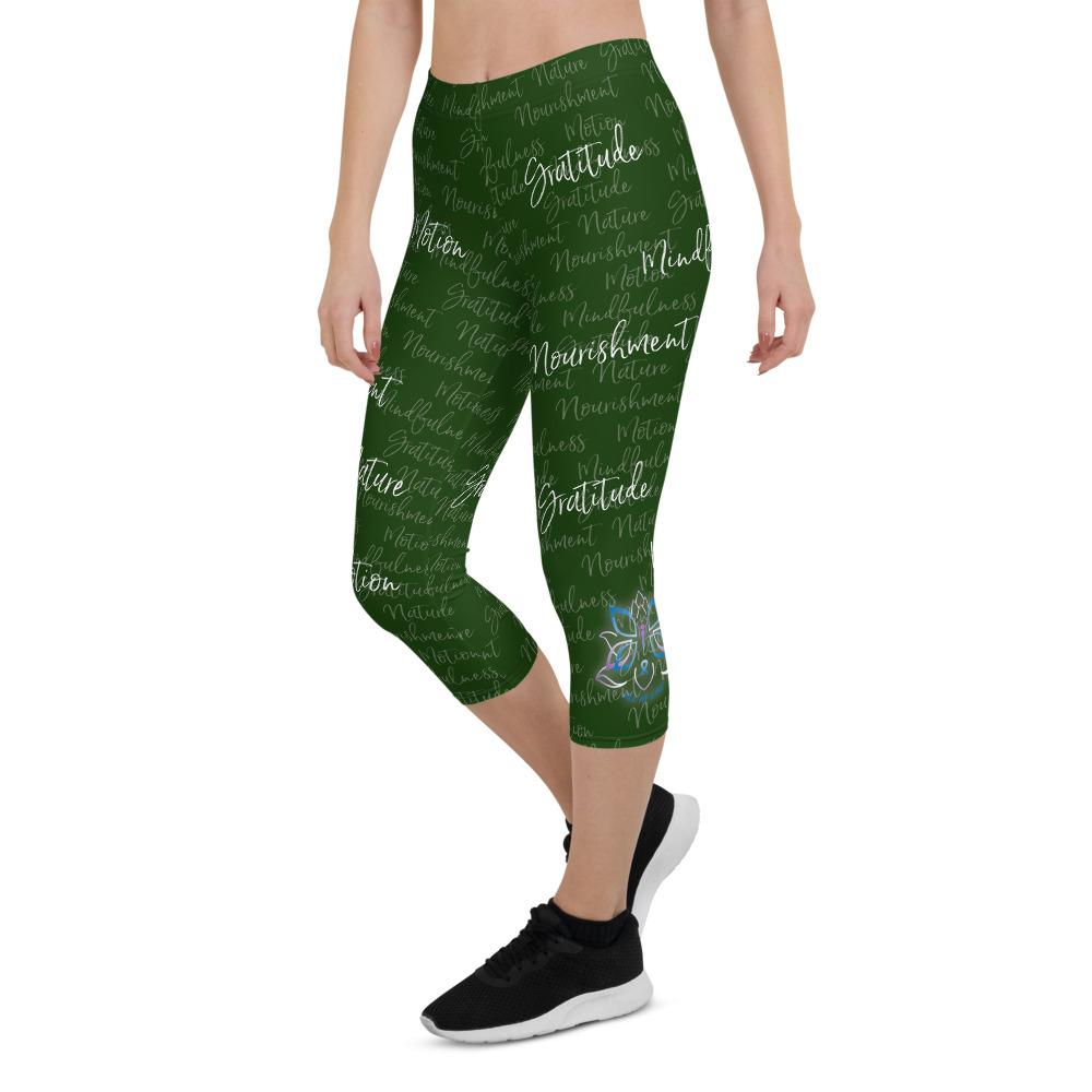 These Kristin Zako capri leggings are filled with her four pillars phrases and topped off with her logo on each side. They are super soft and comfortable. Shown in green, front  left view.