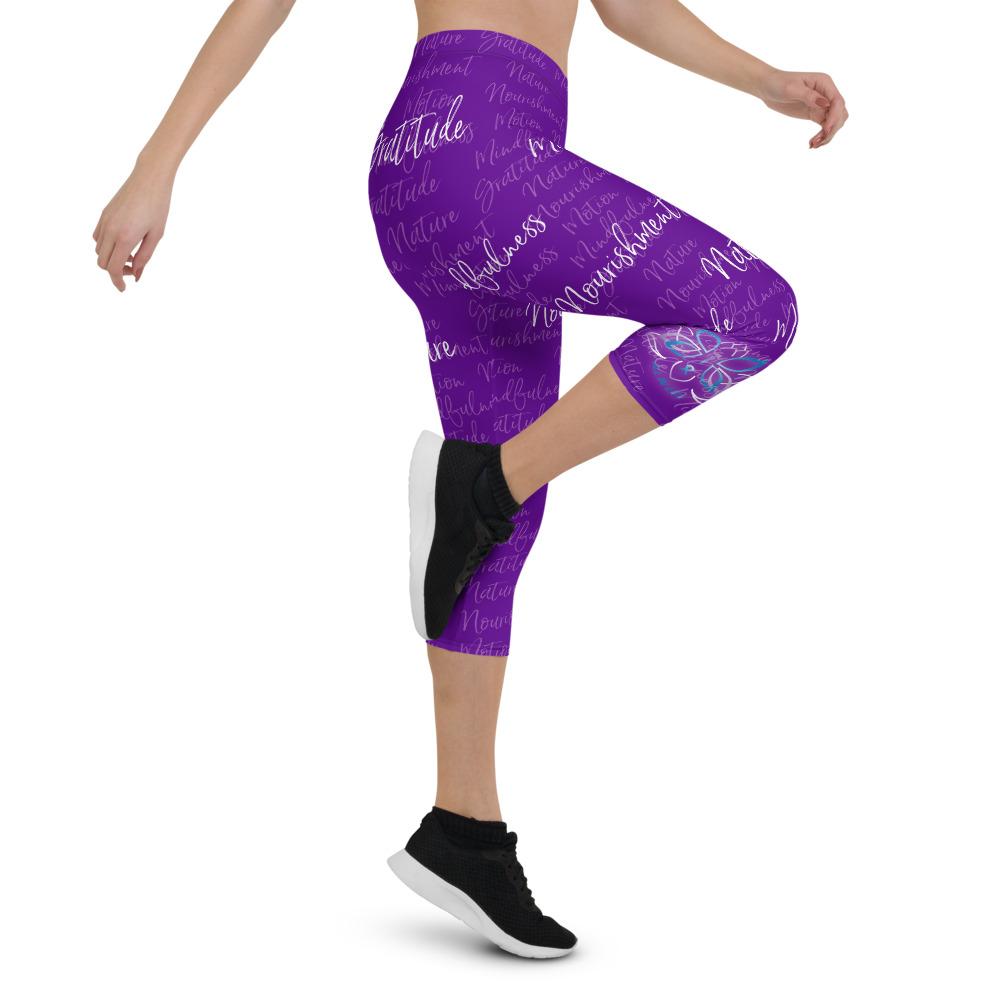 These Kristin Zako capri leggings are filled with her four pillars phrases and topped off with her logo on each side. They are super soft and comfortable. Shown in purple, right view.