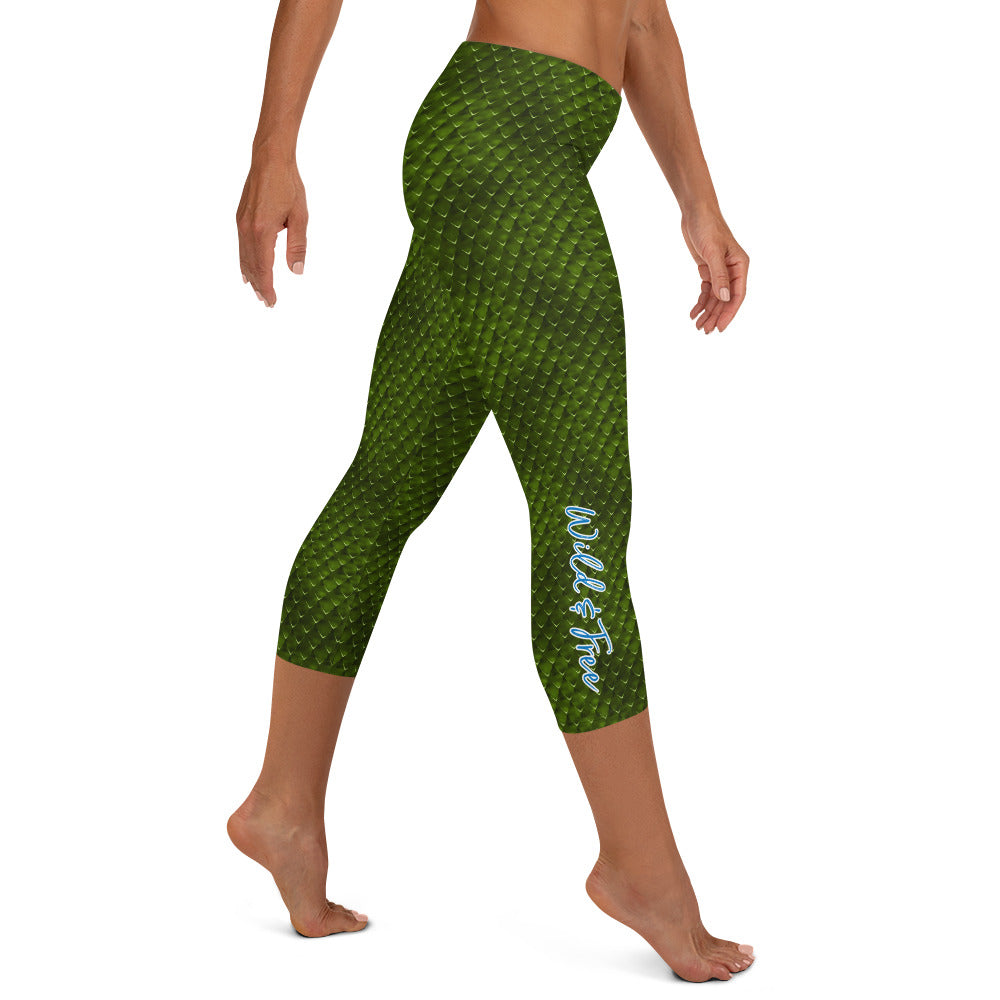 Kristin Zako embodies the "Wild & Free" spirit of her print capri leggings. These are printed in vivid color with a stylized cheetah print. The words, "WILD & FREE" are down the right leg and you'll find Kristin's logo on the lower left leg. Snake skin style - right view.