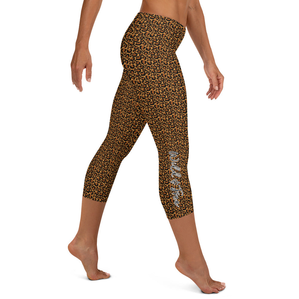 Kristin Zako embodies the "Wild & Free" spirit of her print capri leggings. These are printed in vivid color with a stylized cheetah print. The words, "WILD & FREE" are down the right leg and you'll find Kristin's logo on the lower left leg. Leopard style - right view.