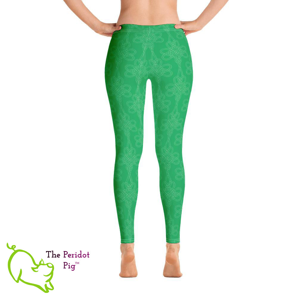 Avoid the pinching on St Patrick's Day with a pair of bright green leggings! These leggings feature a shamrock Celtic-style knot pattern set on a bright kelly green background. Back view.