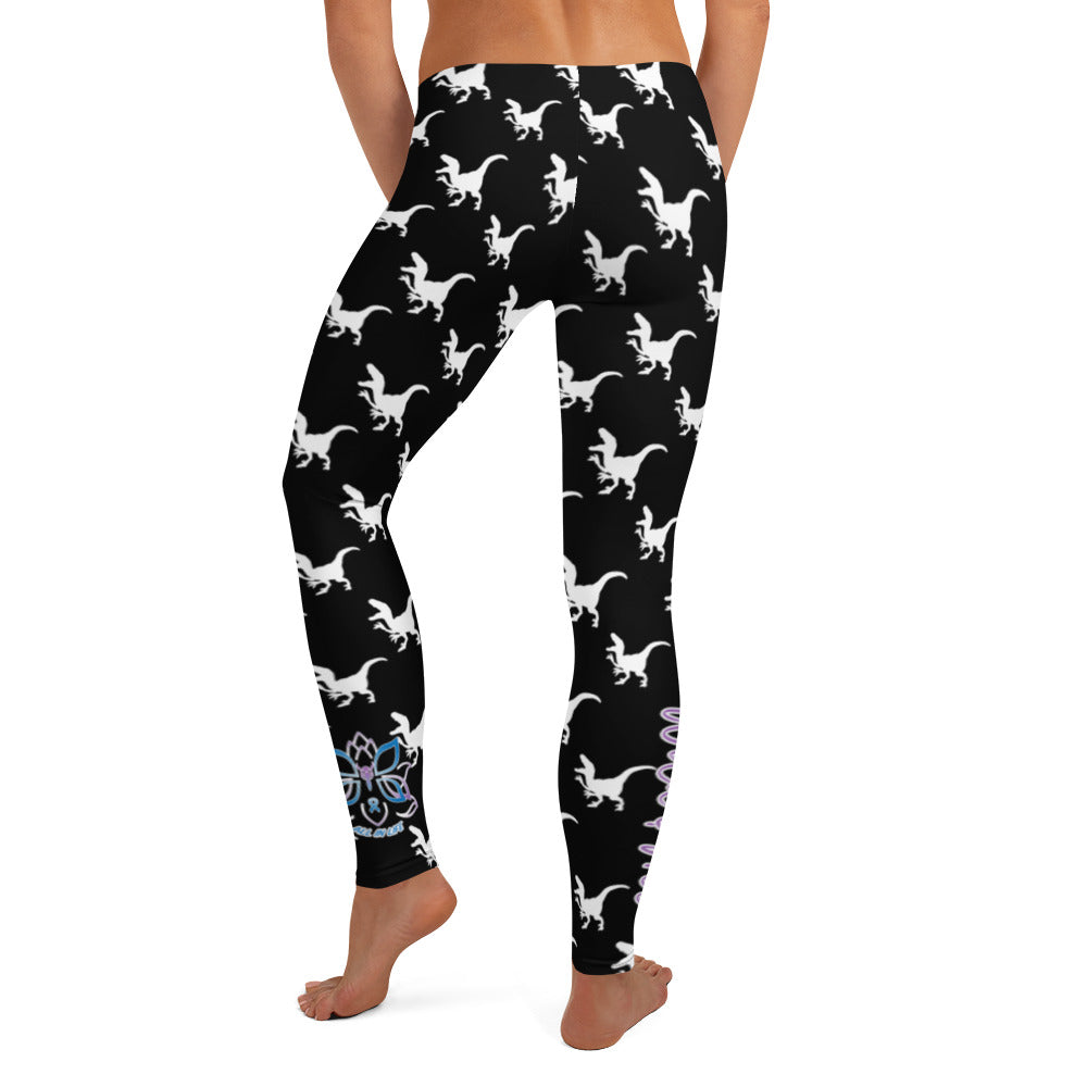Kristin Zako embodies the "Wild & Free" spirit of her print leggings. These are extra special as they are printed in black and white color with a velociraptor silhouette.  The words, "WILD & FREE" are down the right leg and you'll find Kristin's logo on the lower left leg. Back view.