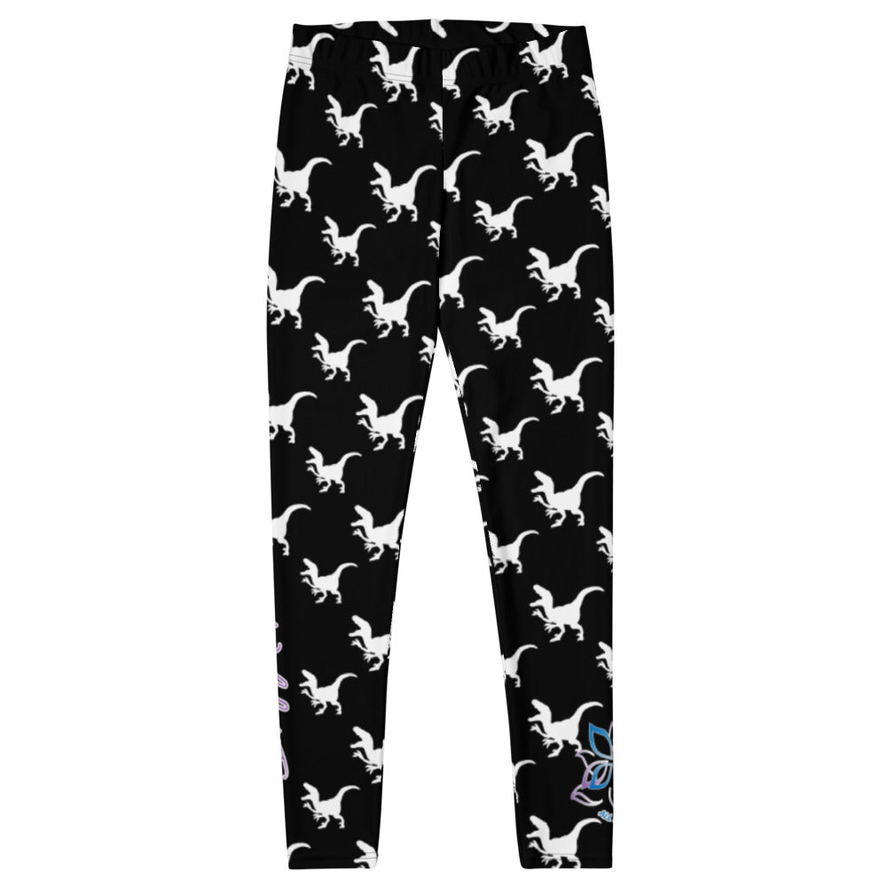 Kristin Zako embodies the "Wild & Free" spirit of her print leggings. These are extra special as they are printed in black and white color with a velociraptor silhouette.  The words, "WILD & FREE" are down the right leg and you'll find Kristin's logo on the lower left leg. Flat front view.