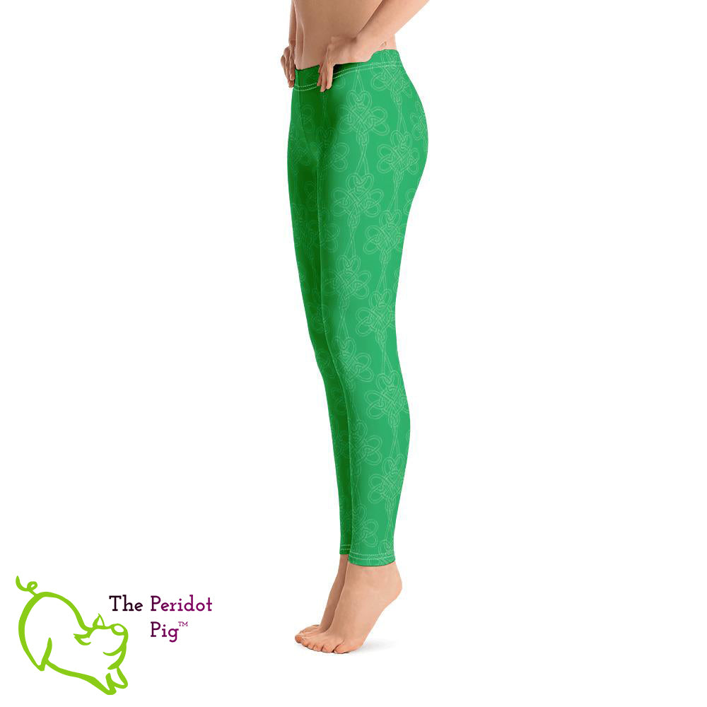 Avoid the pinching on St Patrick's Day with a pair of bright green leggings! These leggings feature a shamrock Celtic-style knot pattern set on a bright kelly green background. Left view.