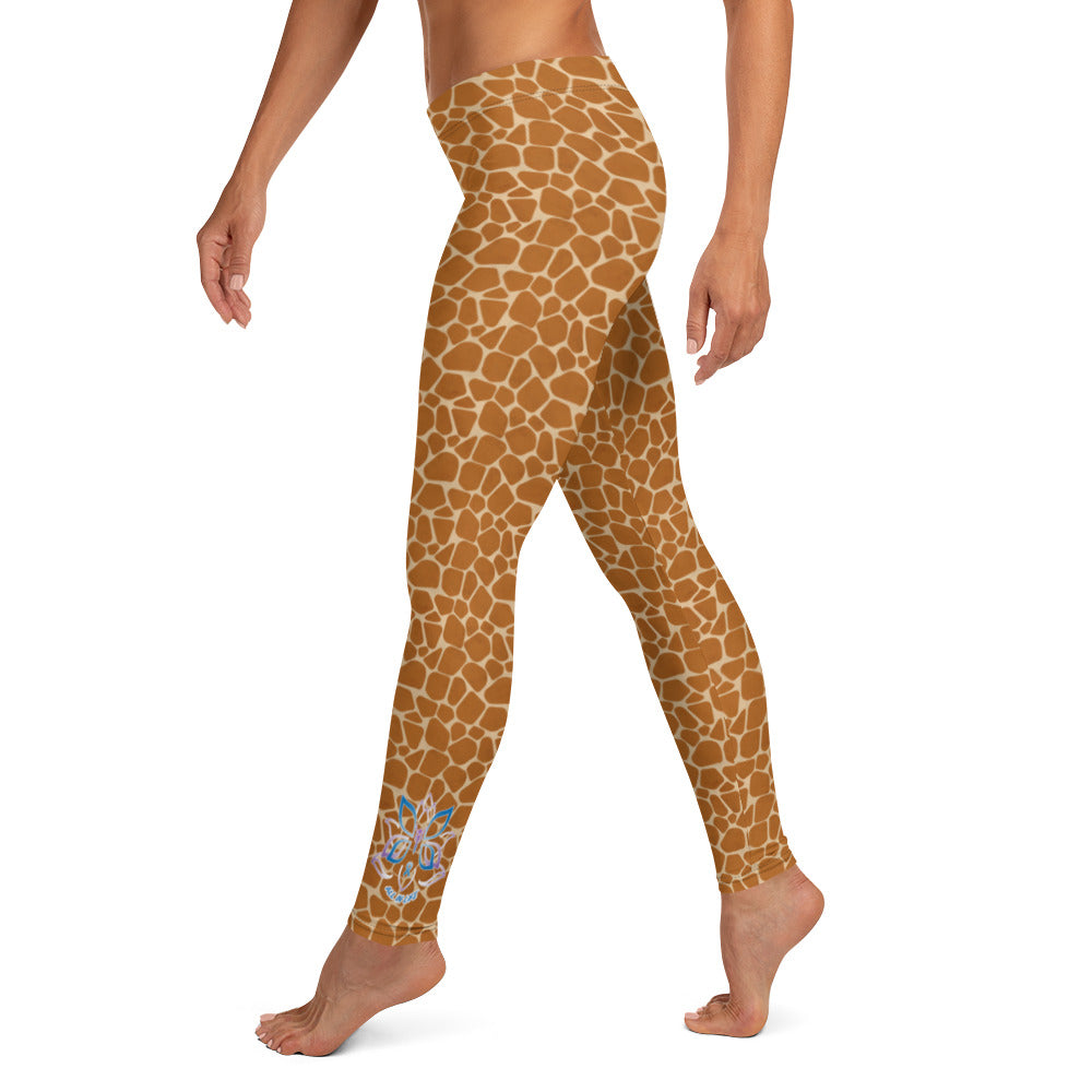 Kristin Zako embodies the "Wild & Free" spirit of her giraffe print leggings. These are printed in vivid color with a stylized giraffe print.  The words, "WILD & FREE" are down the right leg and you'll find Kristin's logo on the lower left leg. left view.
