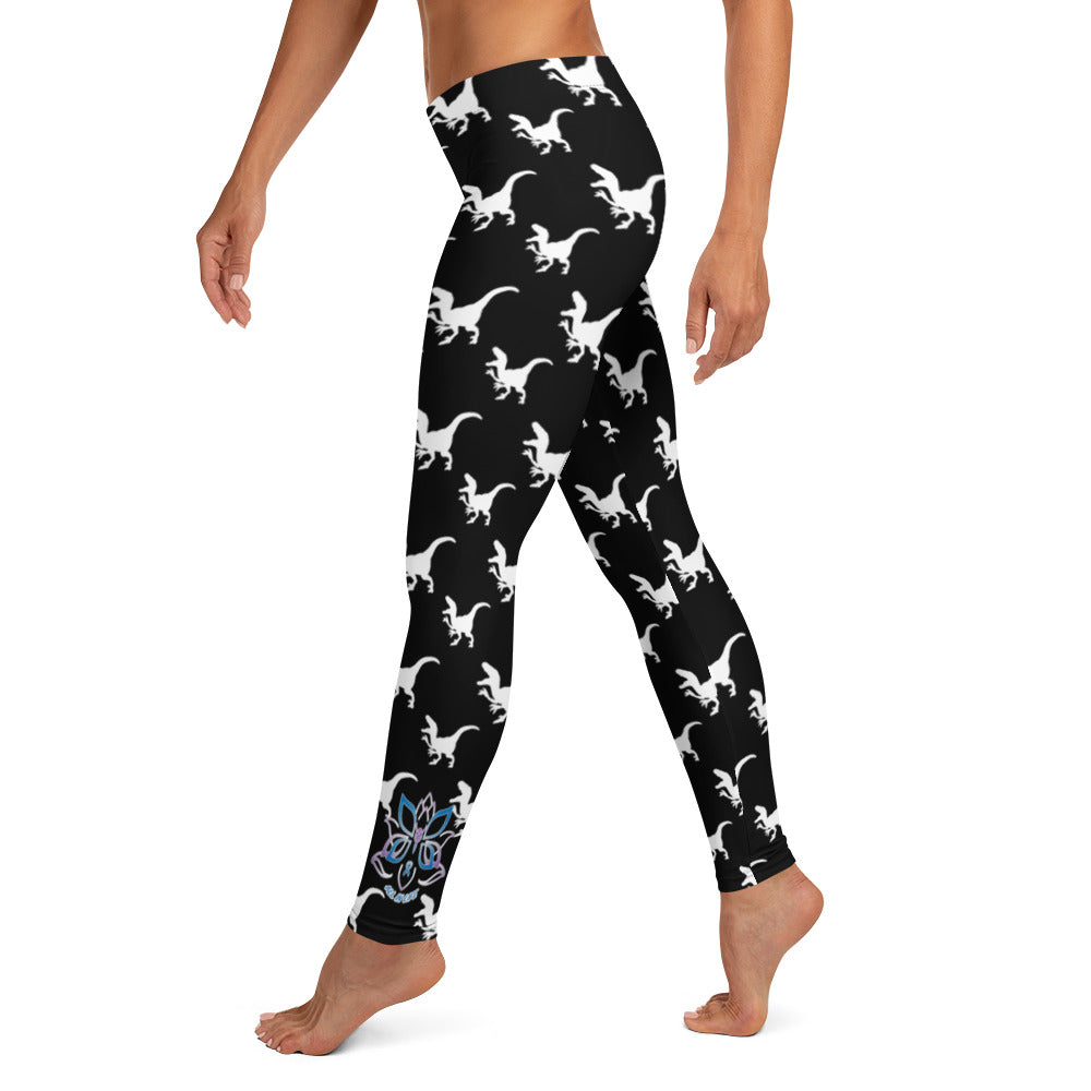 Kristin Zako embodies the "Wild & Free" spirit of her print leggings. These are extra special as they are printed in black and white color with a velociraptor silhouette.  The words, "WILD & FREE" are down the right leg and you'll find Kristin's logo on the lower left leg. Left view.